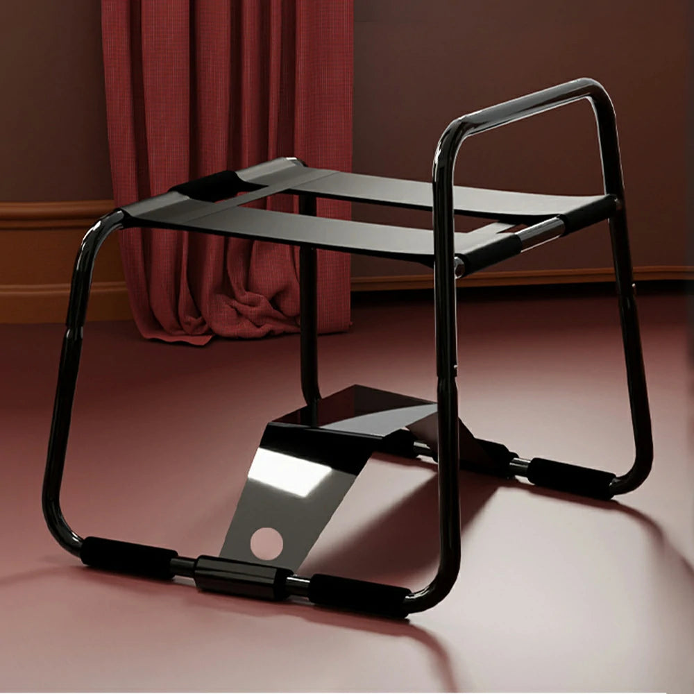 Black elastic sex chair with dual straps and square armrests.