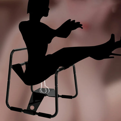 Black elastic sex chair with dual straps and square armrests.