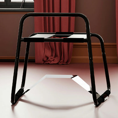 Black elastic sex chair with dual straps and square armrests.