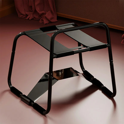 Black elastic sex chair with dual straps and square armrests.